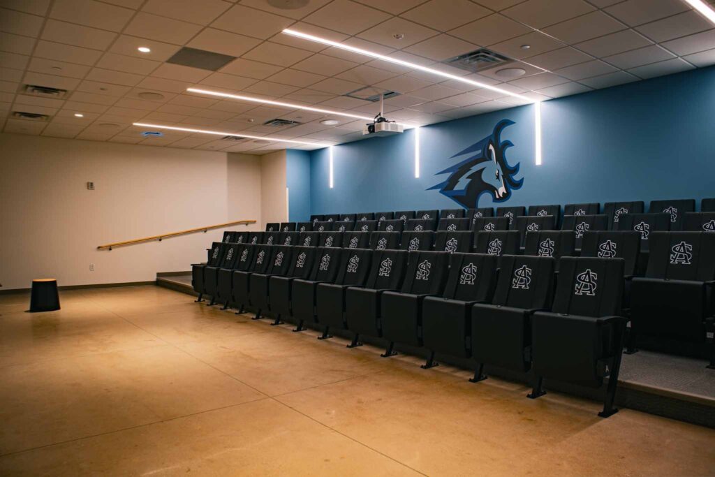 Photo of film room with blue background.
