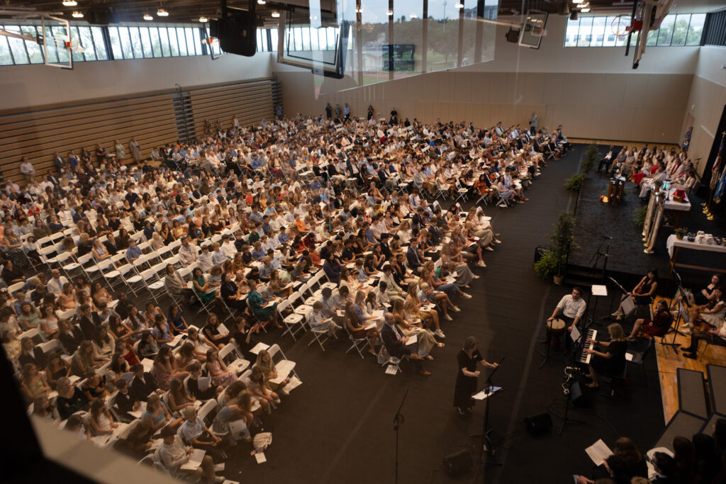 Photo of full crowd standing in Dunham Court.