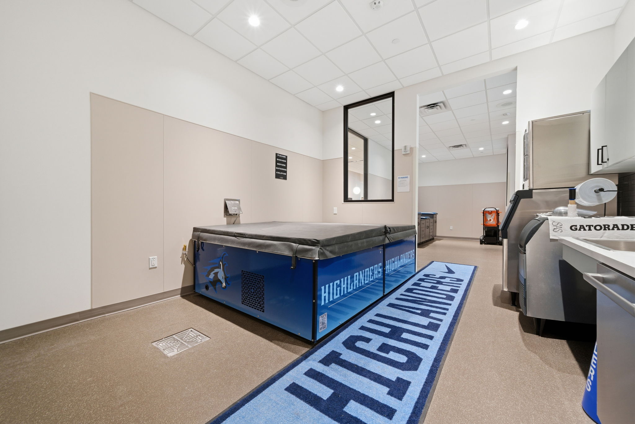 Photo of therapy cool tub. Blue highlanders runner rug is beside the tub.