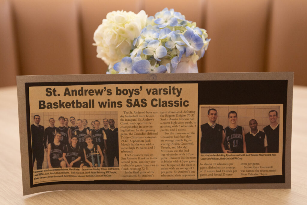 Newspaper clipping of an article titled "St. Andrew's boys' varsity Basketball wins SAS Classic."