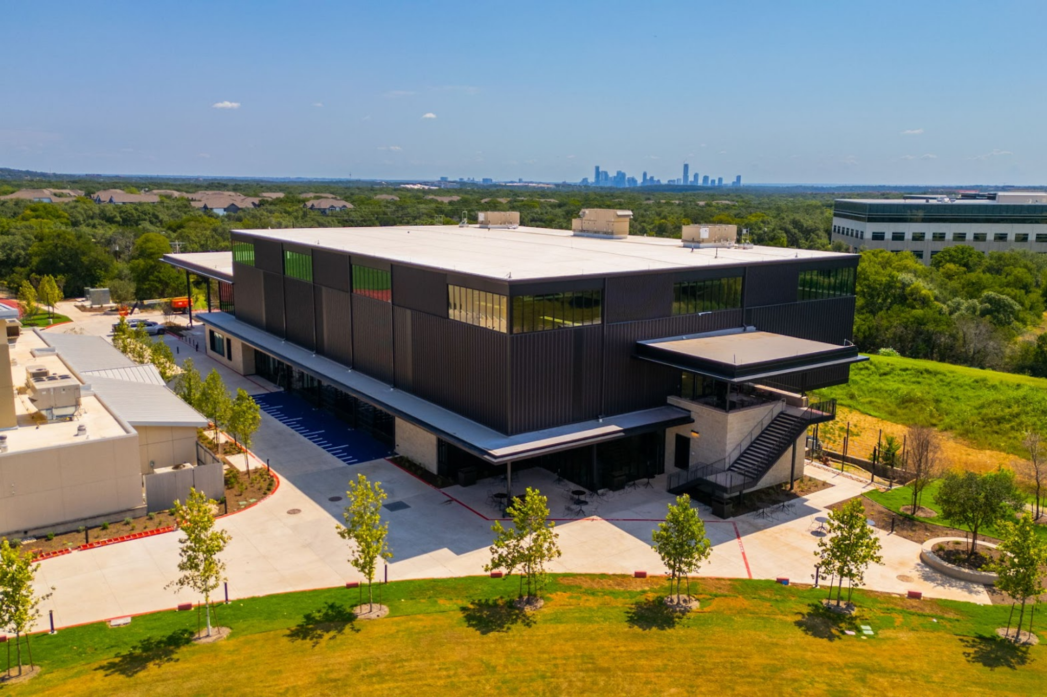 Drone photo of the back of Highlander Hall, including a staircase leading to Nazro Terrace.
