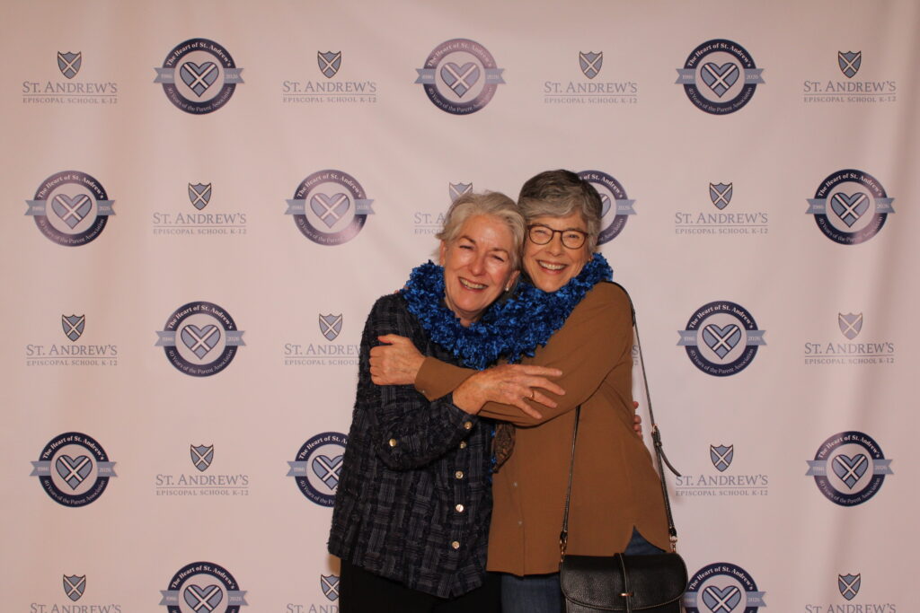 Two past PA presidents hug.